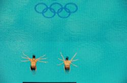 Annett Gamm and Nora Subschinski, of Germany, compete in women's synchronized diving on August 12. They finished fourth.